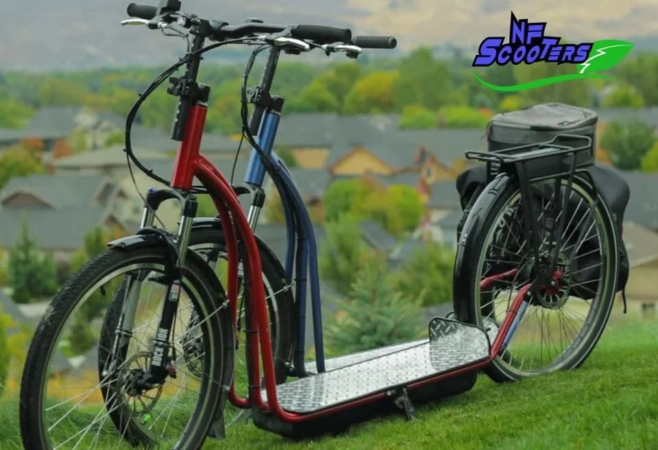 Red and blue NF scooters from 2016 parked on grass
