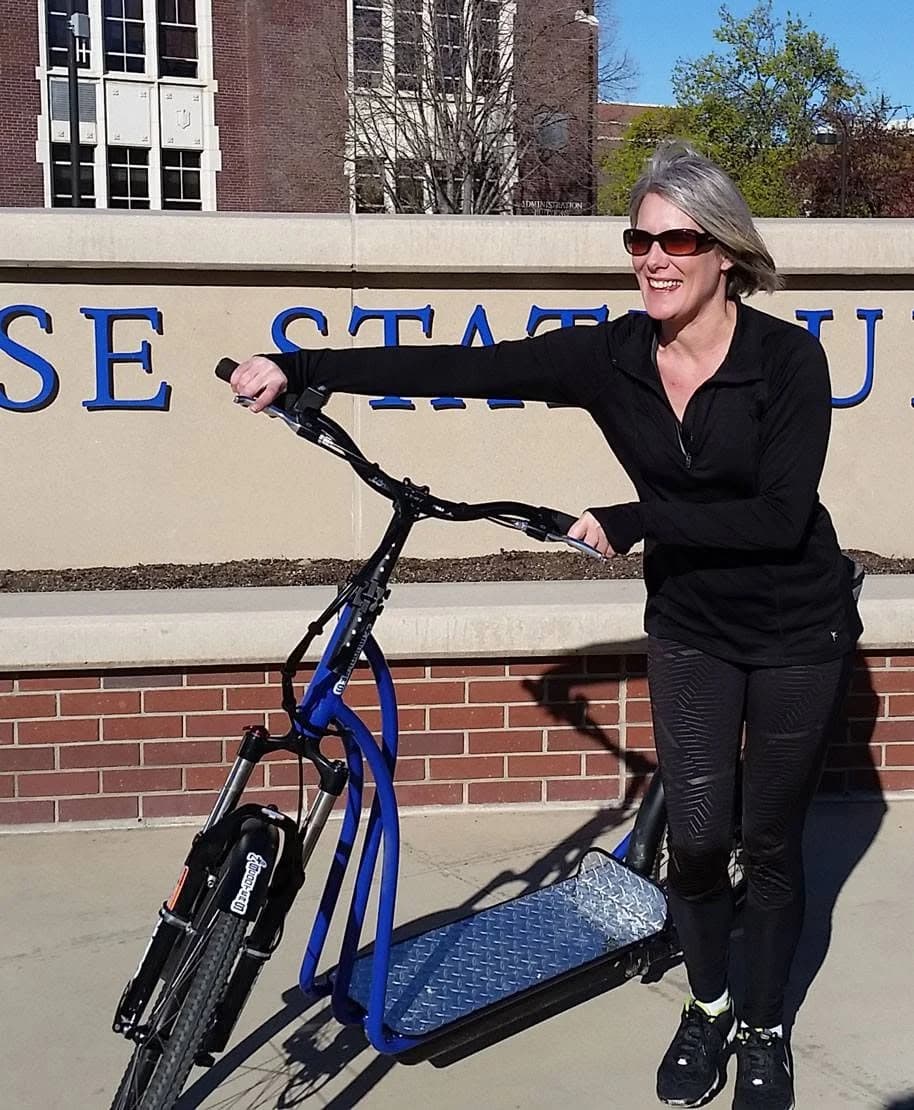 Rider with a blue NF scooter at Boise State