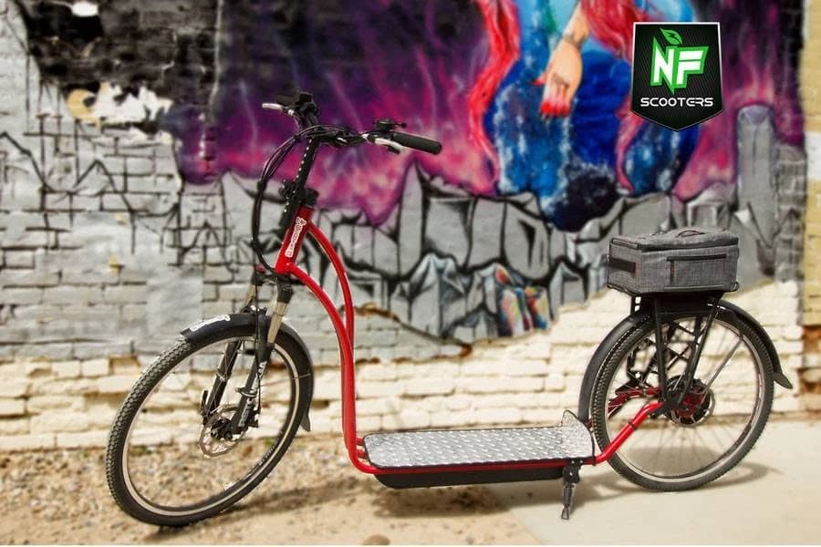 Red 2018 NF scooter with a rear bag in front of a painted mural